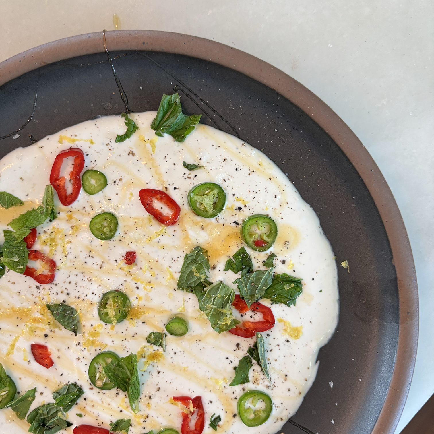 Whipped Goat Cheese Dip with Hot Honey, Chili Pepper, and Crispy Biscuits